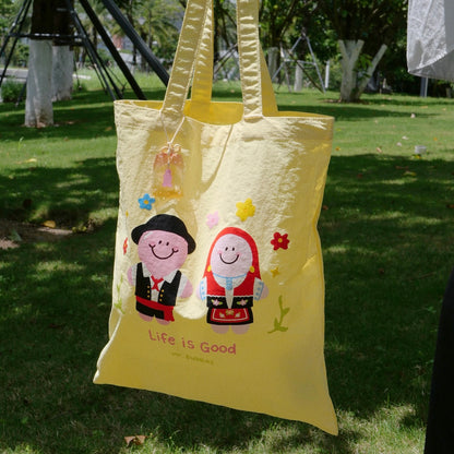 Mr.Bubbles and Petals in Portuguese costumes on yellow Macau-inspired tote bag
