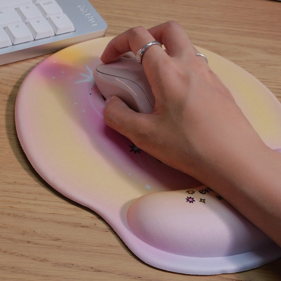 Mr.Bubbles ergonomic mouse pad in use at desk - pink edition